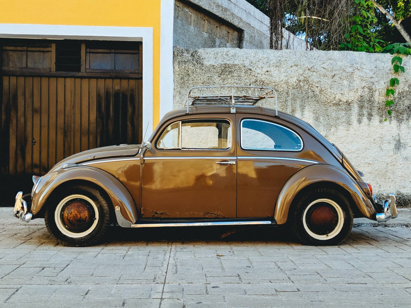 Vintage Car against Wall & Garage